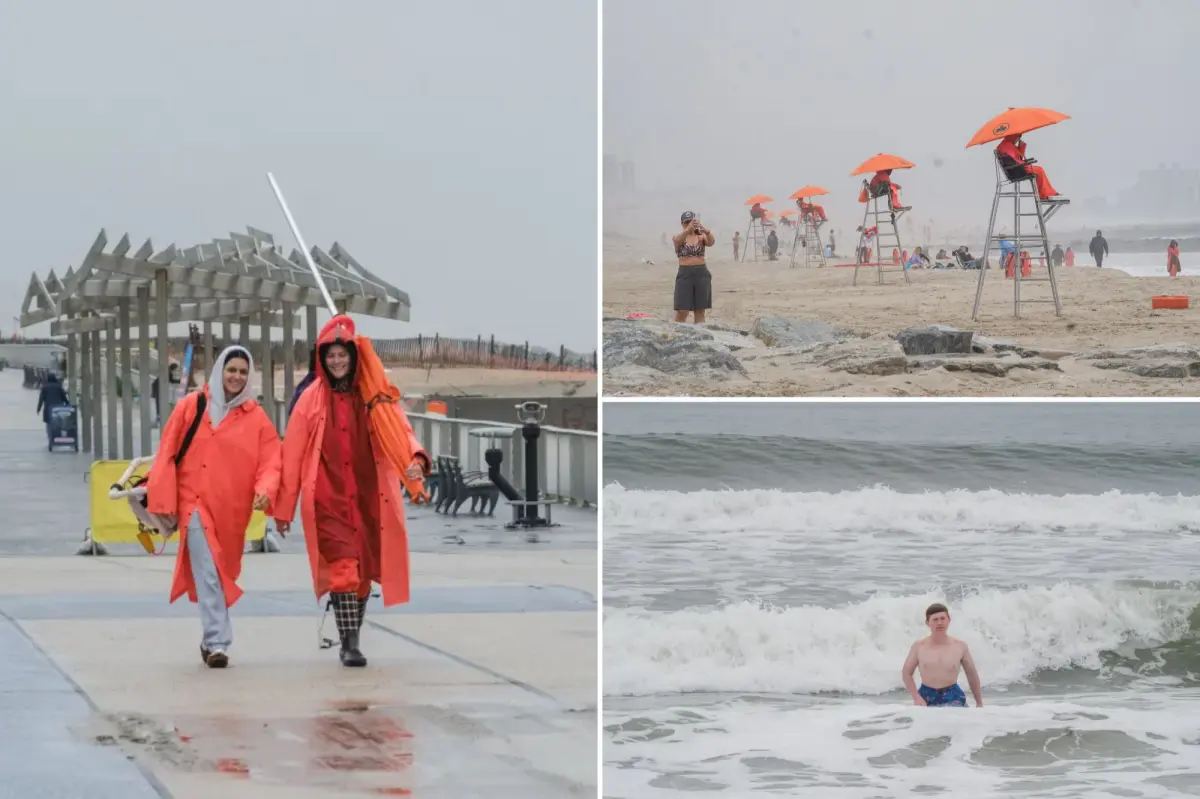Wet Memorial Day scares off NYC beach crowds — but diehard locals stick it out