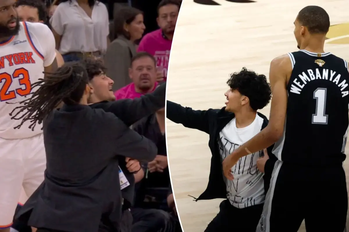 Selfie-taking fan storms court in surreal NBA Finals Game 1 scene