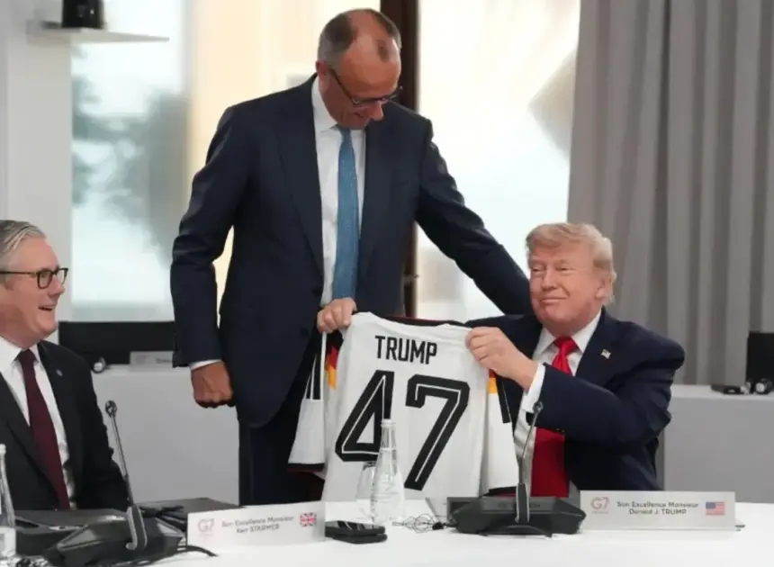 German Chancellor gives Trump a ‘TRUMP 47’ soccer jersey as belated birthday gift at G7 summit