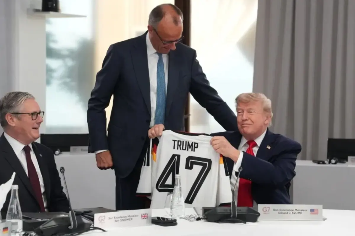 German Chancellor gives Trump a ‘TRUMP 47’ soccer jersey as belated birthday gift at G7 summit