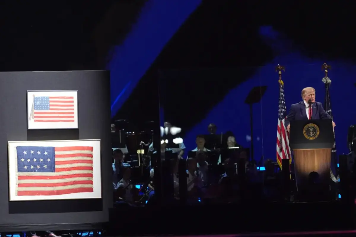 Trump has one of the country’s first flags on stage, dating from 1777, during Fourth of July speech