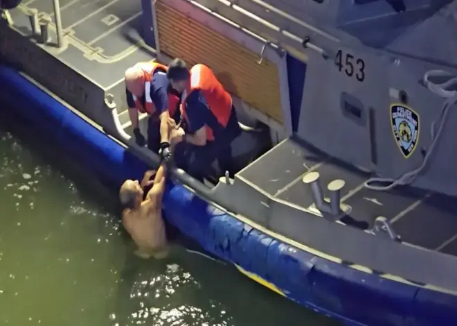 Dramatic video shows naked man being pulled from East River by NYC cops