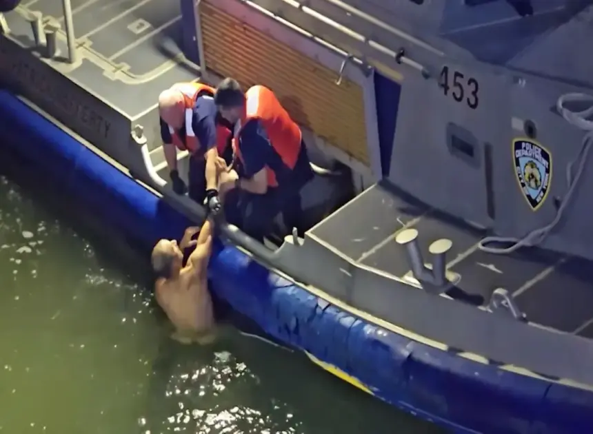 Dramatic video shows naked man being pulled from East River by NYC cops