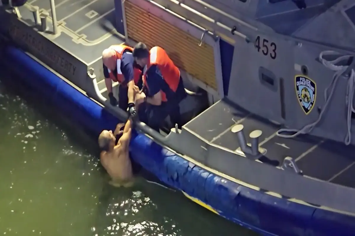 Dramatic video shows naked man being pulled from East River by NYC cops